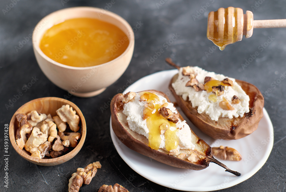 grilled pears baked with ricotta cheese and walnuts. honey topping. dieting sweet dessert,vegetarian food grilled pears baked with ricotta cheese and walnuts. honey topping. dieting sweet dessert,vegetarian food