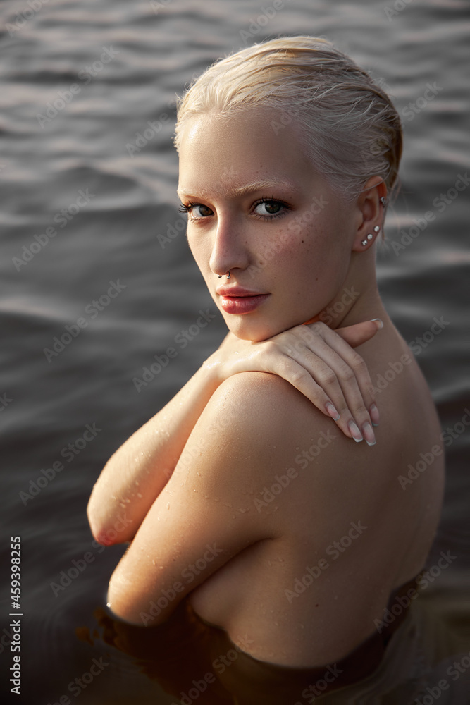 Sexy Naked Wet Girl Big Tits - Nude naked sexy woman in water at sunset. Beautiful blonde woman with short  wet hair and big breasts, art portrait in sea Stock Photo | Adobe Stock