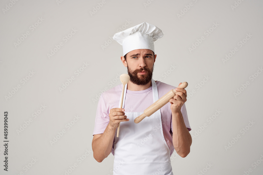male chef with a cap on his head tasting food professional cooking male chef with a cap on his head tasting food professional cooking