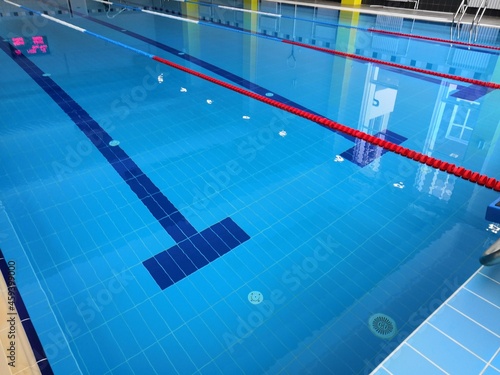  a large, clean and new swimming pool in the educational institution. Swimming tracks and clear water, everything is ready for the competition. Curbstones, pedestals for diving into the water