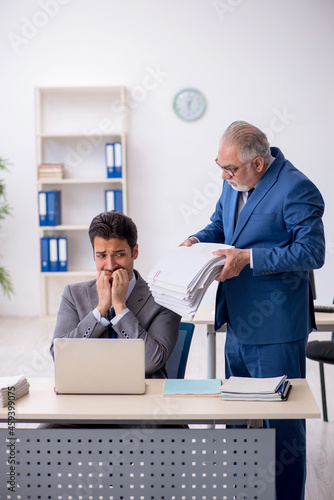 Two male colleagues working in the office