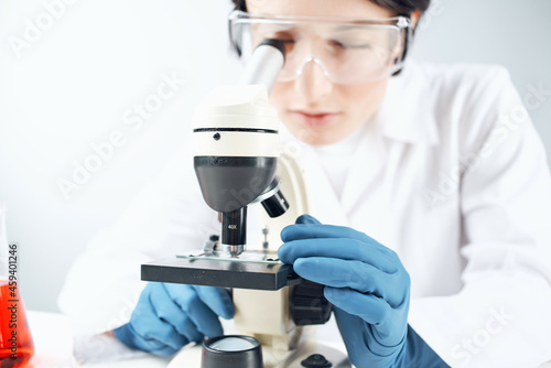 woman laboratory assistant microscope science professional analysis biotechnology