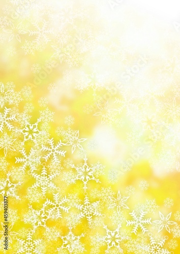 雪の結晶が散りばめられた金色の背景