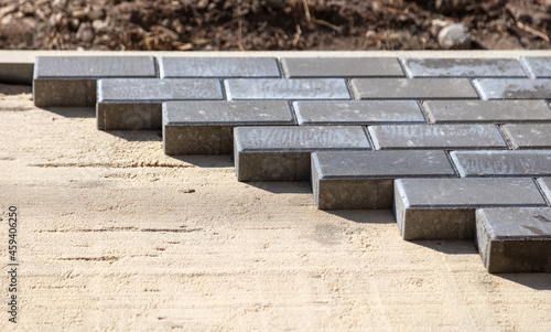 Laying paving slabs at a construction site.