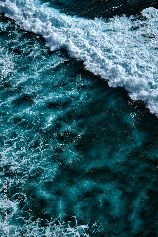 Fototapeta premium Aerial view to waves in ocean Splashing Waves. Blue clean wavy sea water.