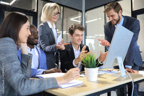 Modern business people discuss the new project at office.
