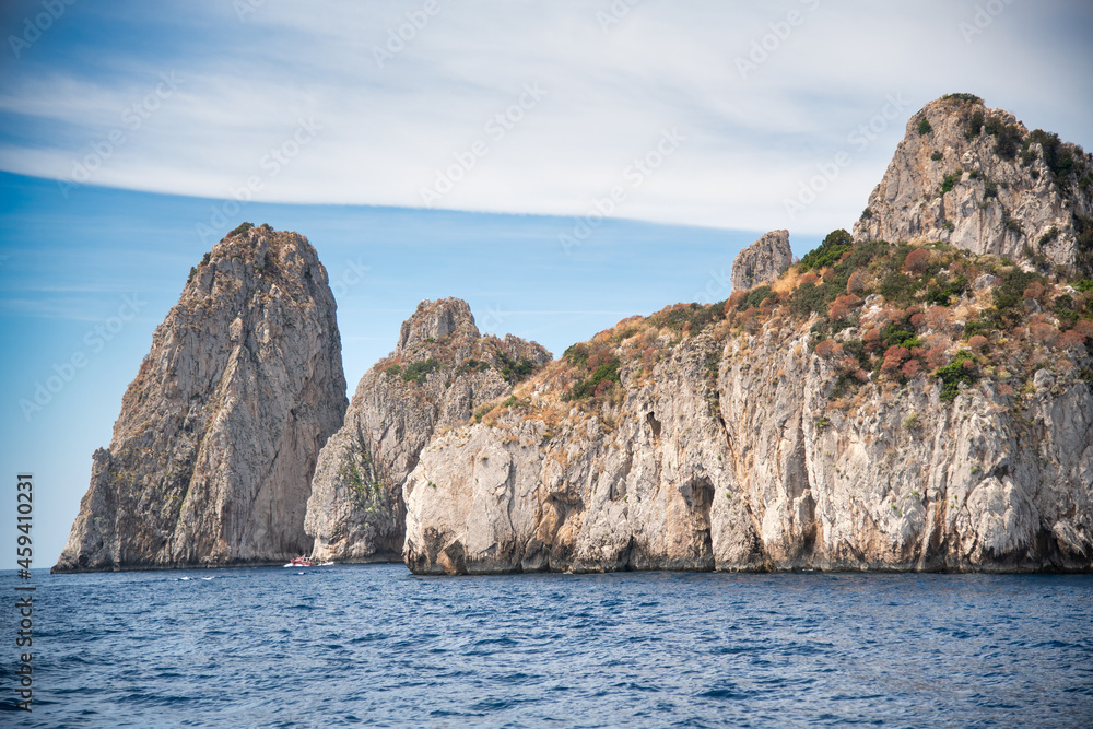 View of famous Faraglioni rocks from the sea, Capri - Italy.