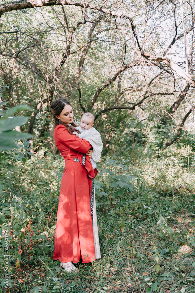 Family shooting in a fairy tale style in an apple grove