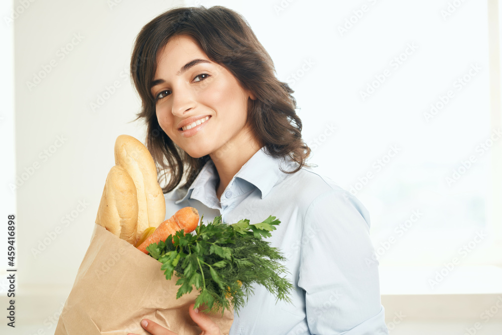 woman with a package of groceries vegetables supermarket shopping woman with a package of groceries vegetables supermarket shopping