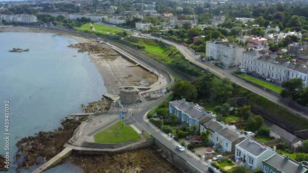 Martello Tower, Seapoint, Monkstown, Dublin, Ireland, September 2021. Drone gradually orbits the tower while ascending above Brighton Vale terrace revealing the view east to Dún Laoghaire. Martello Tower, Seapoint, Monkstown, Dublin, Ireland, September 2021. Drone gradually orbits the tower while ascending above Brighton Vale terrace revealing the view east to Dún Laoghaire.