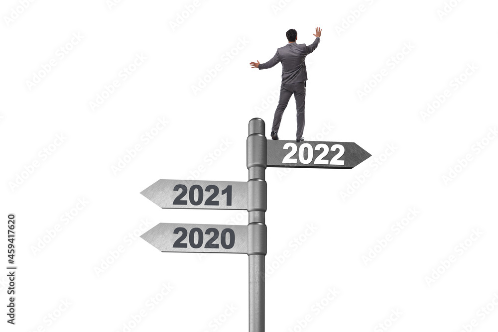 Businessman on the signpost from 2021 to 2022 Businessman on the signpost from 2021 to 2022