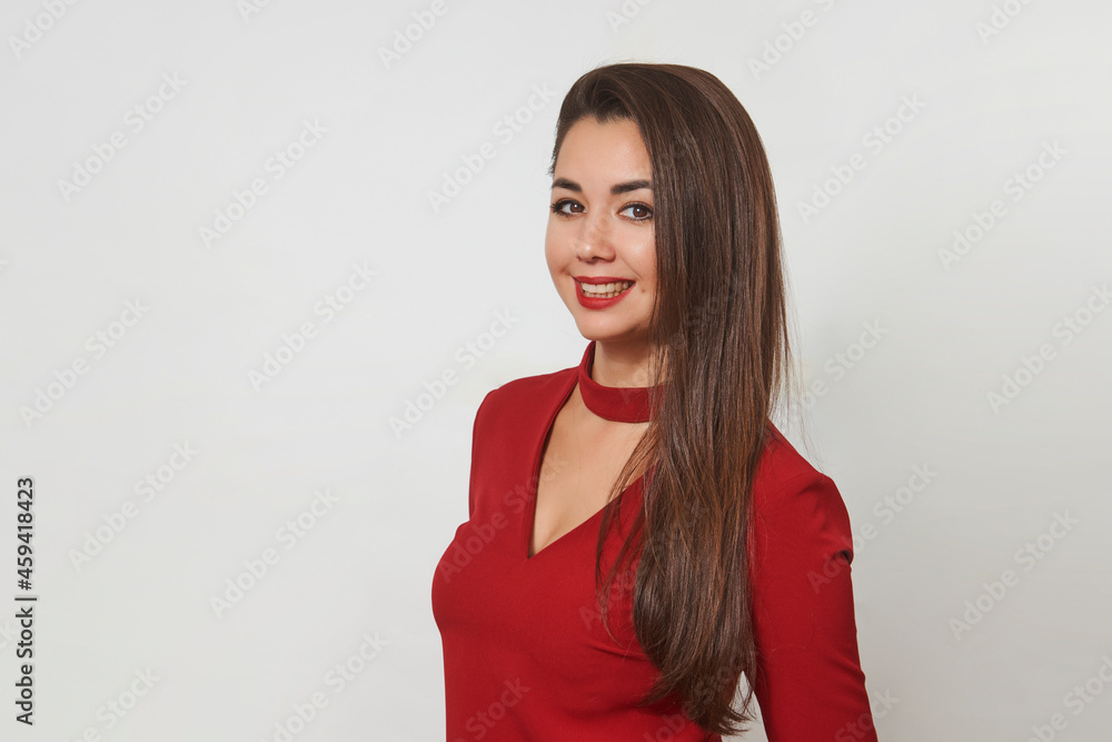 Portrait of a beautiful smiling young girl in red dress Portrait of a beautiful smiling young girl in red dress