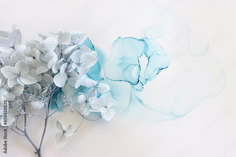Creative image of pastel blue Hydrangea flowers on artistic ink background. Top view with copy space - obrazy, fototapety, plakaty 