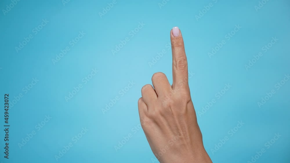 Closeup 4k of isolated on blue adult female hand counting from 0 to 5. Woman shows fist fist, then one, two, three, four, five fingers. Manicured nails painted with beautiful pink polish. Math concept Closeup 4k of isolated on blue adult female hand counting from 0 to 5. Woman shows fist fist, then one, two, three, four, five fingers. Manicured nails painted with beautiful pink polish. Math concept