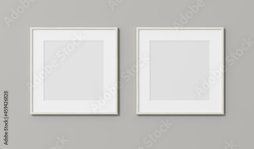 Square wooden frames with passe partout on white wall. 3D render wooden frame mock up in the empty interior. 3D illustrations. Shadow on the wall. Place for your text. Template for design. 