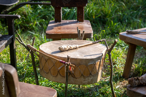 North American Indian drum made of rawhide with bat ready to play photo