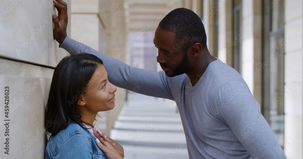 Cute romantic black couple spending time together in city Cute romantic black couple spending time together in city