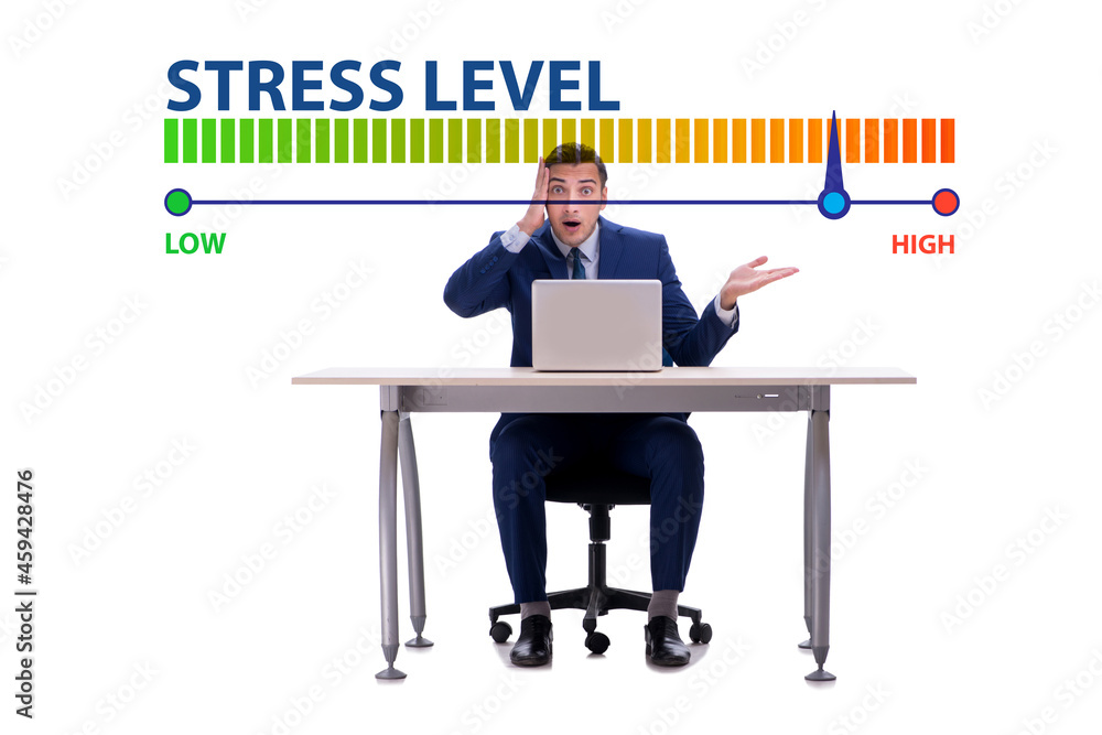 Businessman with meter measuring his stress level Businessman with meter measuring his stress level