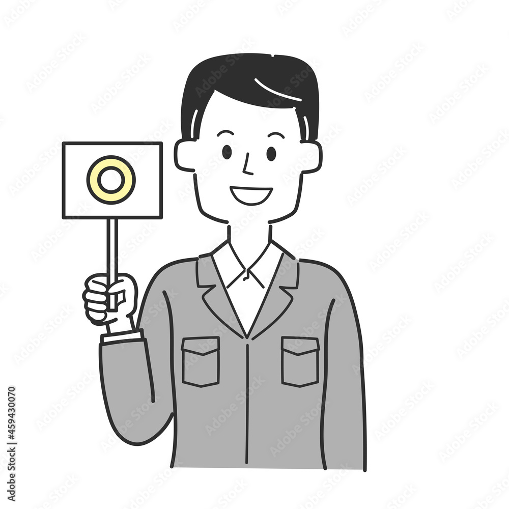 丸が書かれた札を持っている工務店の社員