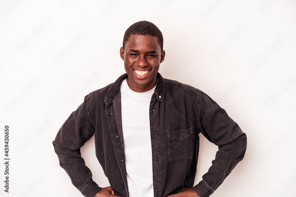 Young African American man isolated on white background confident keeping hands on hips. Young African American man isolated on white background confident keeping hands on hips.