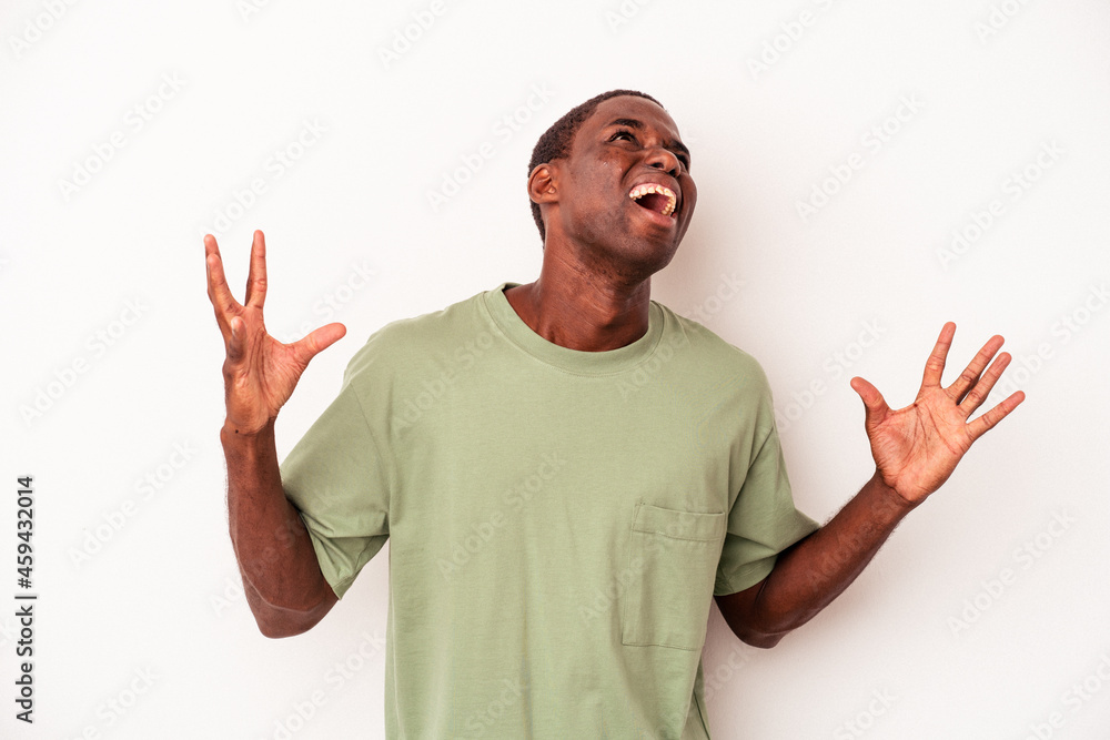 Young African American man isolated on white background screaming to the sky, looking up, frustrated.