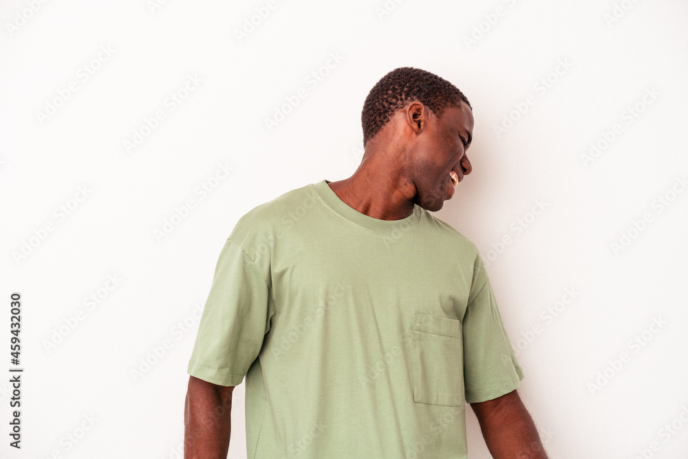 Obraz premium Young African American man isolated on white background dancing and having fun.
