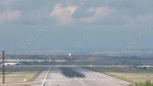 HD VIdeo of a plane, Airbus A320 of the Iberia Express airline taking off from the runway photo
