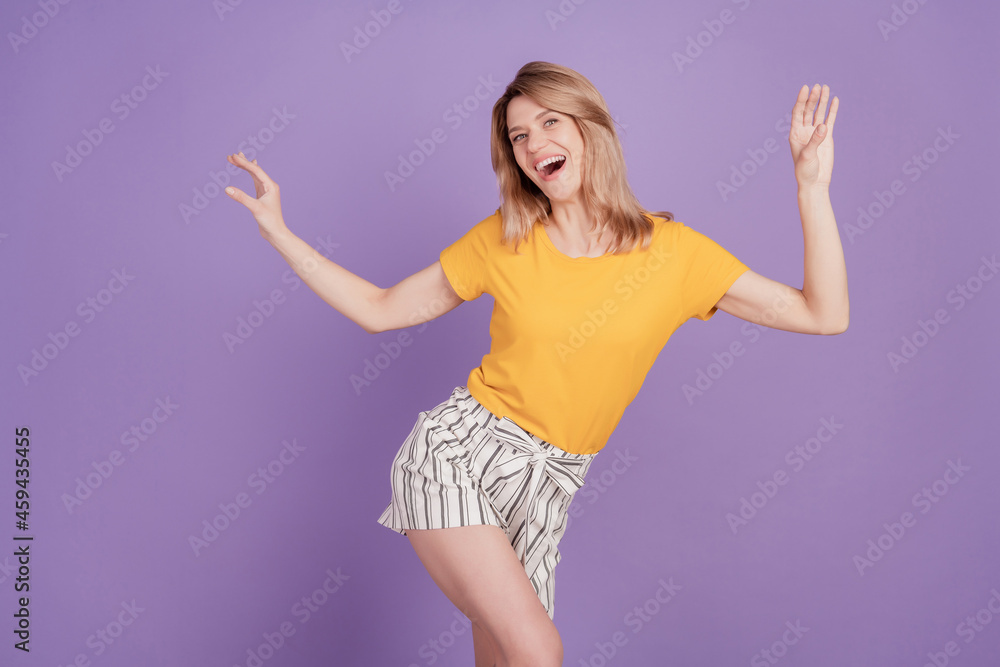 Naklejka premium Photo of young cheerful woman happy positive smile have fun dance disco party isolated over violet color background