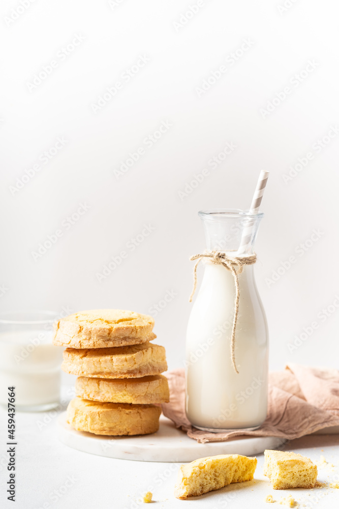 Freshly baked homemade honey cookies with milk for breakfast on a white background Freshly baked homemade honey cookies with milk for breakfast on a white background