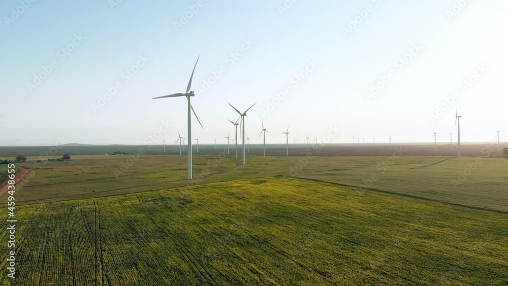 General view of wind turbines in countryside landscape with cloudless sky General view of wind turbines in countryside landscape with cloudless sky