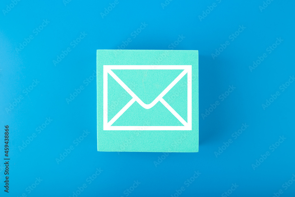 Email marketing, newsletter, promotion information and virtual communication concept. Envelope drawn on toy square against blue background. Email marketing, newsletter, promotion information and virtual communication concept. Envelope drawn on toy square against blue background.