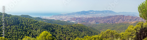 Panoramic view on the city of Malaga and its airport valley, from Montes de Malaga natural park photo