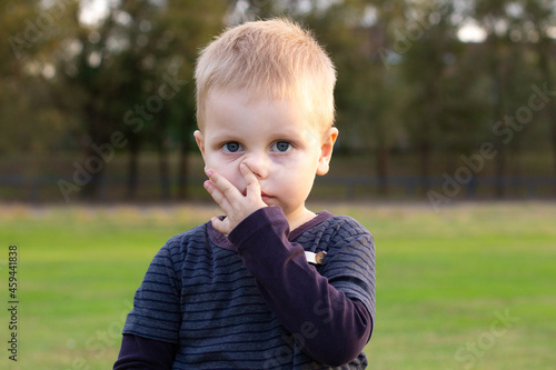 three year old toddler boy with snot runny nose allergy virus ill boy