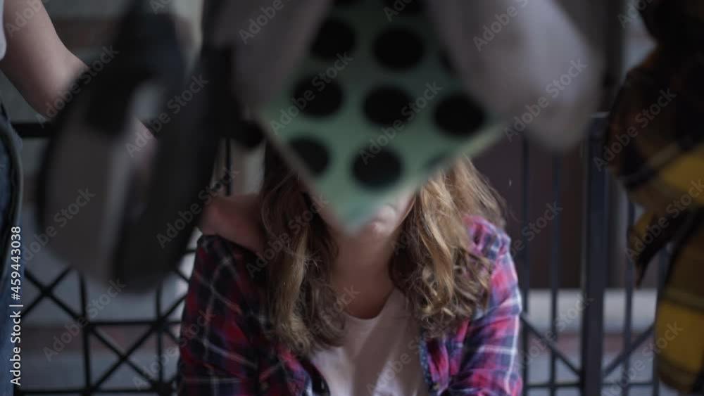 Portrait of desperate crying teenage girl looking at camera as bullies taking off eyeglasses shaking out backpack running away leaving. Hopeless Caucasian beautiful student bullied by classmates Portrait of desperate crying teenage girl looking at camera as bullies taking off eyeglasses shaking out backpack running away leaving. Hopeless Caucasian beautiful student bullied by classmates