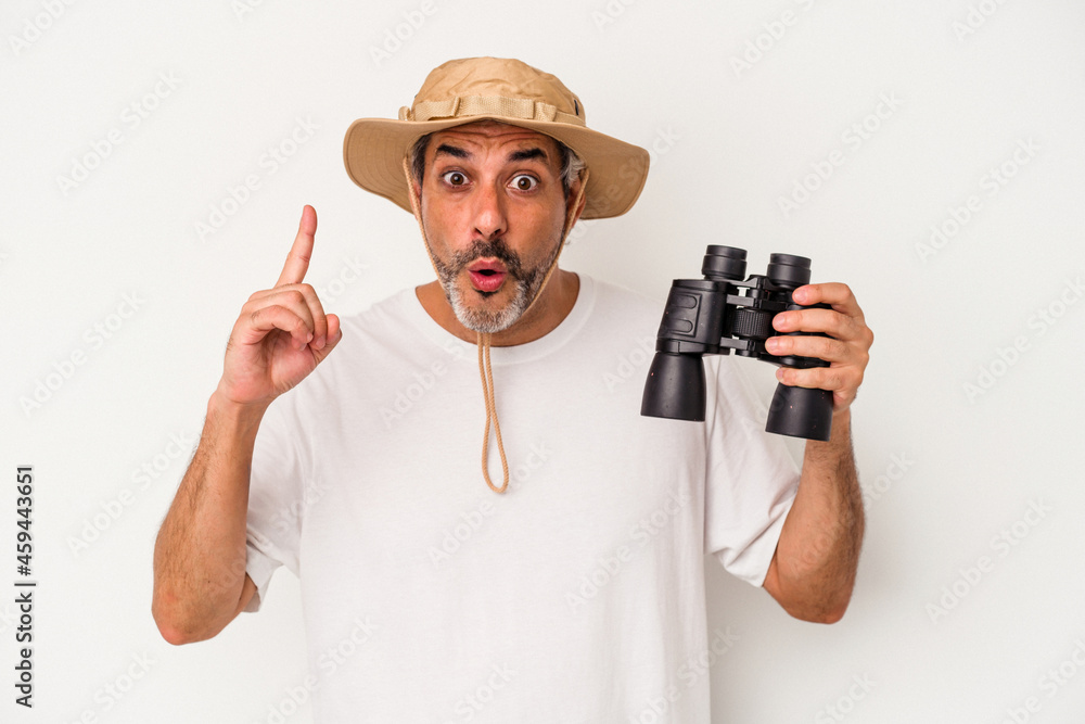 Middle age caucasian man holding binoculars isolated on white background having an idea, inspiration concept. Middle age caucasian man holding binoculars isolated on white background having an idea, inspiration concept.