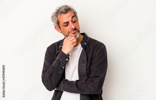 Middle age caucasian man isolated on white background looking sideways with doubtful and skeptical expression.