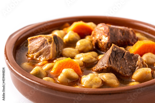 Traditional Spanish cocido madrileño in bowl isolated on white background. Close up	