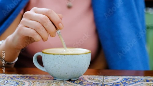 person holding a cup