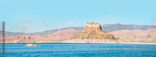 Pertek castle located in Pertek district of Tunceli - Pertek, Turkey Keban dam lake in the foreground photo