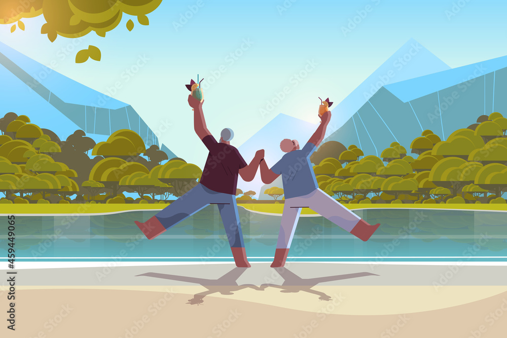 senior couple dancing at lake beach old african american man and woman having fun active old age concept