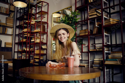 beautiful woman with a book in the hands of a cafe Lifestyle