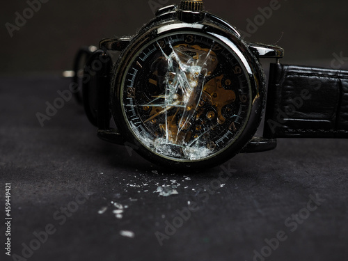 Close up shot of broken black wristwatch