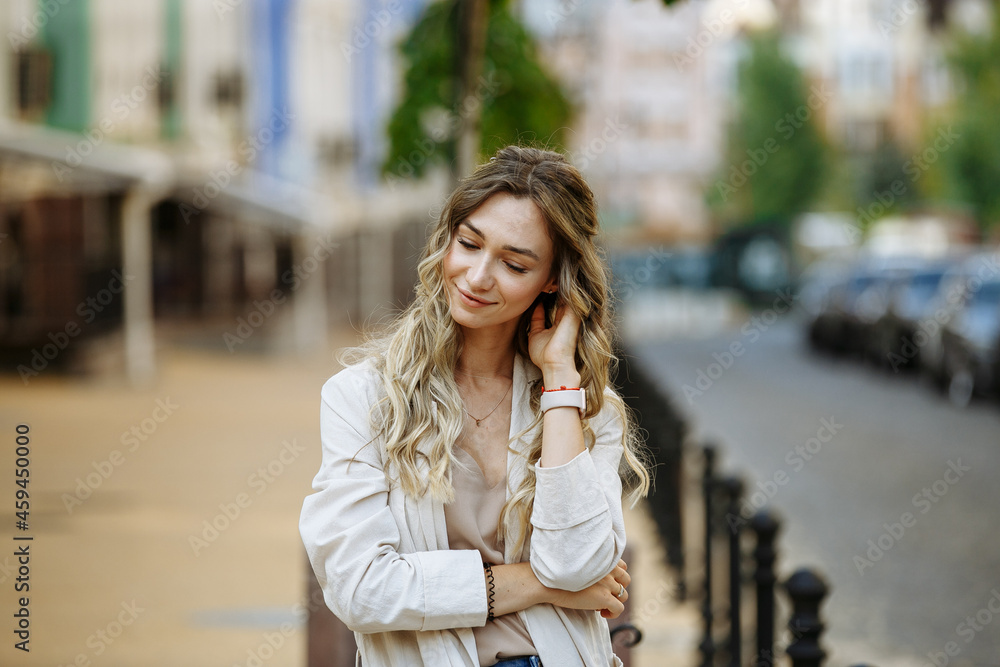 portrait of a girl against the background of a blurred city portrait of a girl against the background of a blurred city