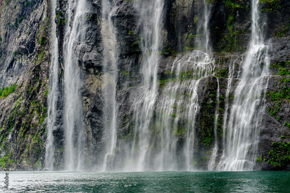 The famous Seven Sisters waterfall in the Geiranger Fjord The famous Seven Sisters waterfall in the Geiranger Fjord
