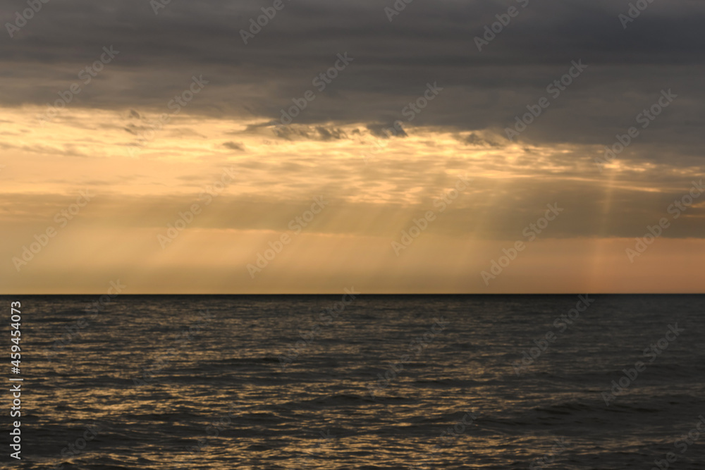 Cloudy sunset over Baltic Sea. Looks like rays from heaven