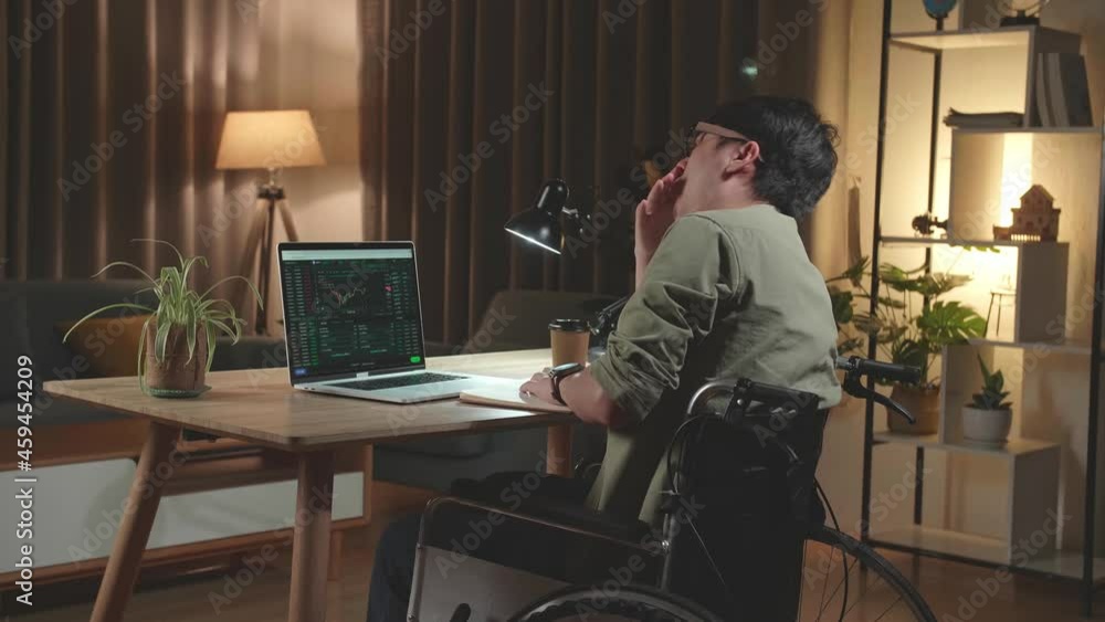 Tried Asian Man Trader Investor Sitting In A Wheelchair And Sleep While Using Laptop Computer For Cryptocurrency Financial Market Analysis, Trading Data Index Chart Graph On Laptop Screen. Back View
Tried Asian Man Trader Investor Sitting In A Wheelchair And Sleep While Using Laptop Computer For Cryptocurrency Financial Market Analysis, Trading Data Index Chart Graph On Laptop Screen. Back View