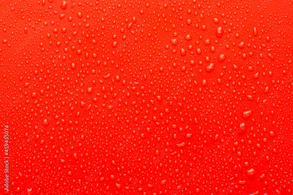 Water drops on metal, red background. May used as background Water drops on metal, red background. May used as background