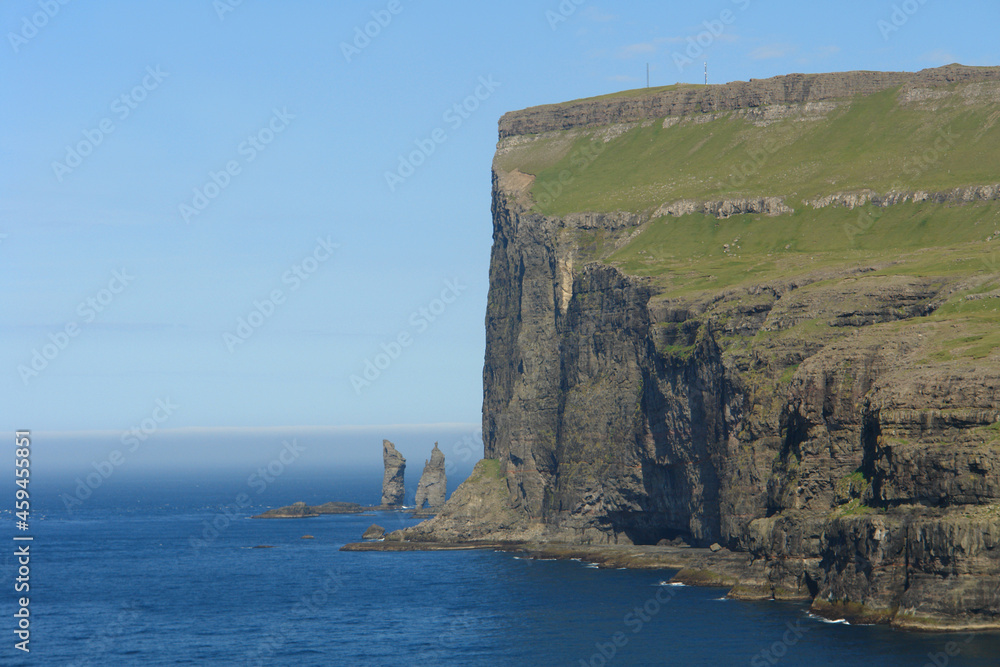 Faroe Islands - Risin and kellingin rocks as seen from tjornuvik bay with waves Faroe Islands - Risin and kellingin rocks as seen from tjornuvik bay with waves