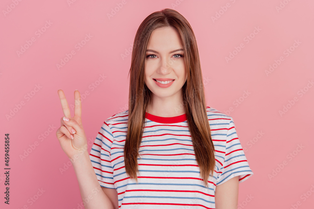 Photo of charming pretty friendly nice lady show v-sign on pink background Photo of charming pretty friendly nice lady show v-sign on pink background