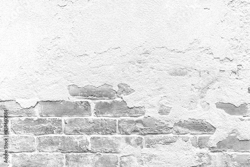 Old cement wall painted white, peeling paint texture and background